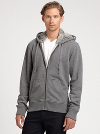 Soft rabbit fur lines the hood of this classic hoodie, finished in comfortable cotton for extra warmth.Zip frontAttached drawstring hoodKangaroo pocketsRibbed knit cuffs and hemCottonMachine washImportedFur origin: China