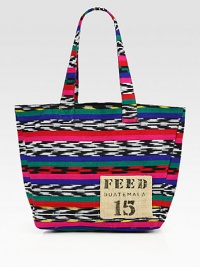 Vibrant and colorful, this eye-catching cotton tote will add cultural flair to any look. Each FEED Guatemala Bag is handcrafted with traditional Ikat fabrics and provides 15 school meals. Double top handles, 9½ dropOpen topOne inside open pocketOrganic cotton and natural burlap lining12W X 12H X 5DImported