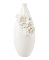 Sculpted camellia blossoms pop with peachy accents against this glossy white Flora vase. A quiet beauty in graceful Lenox porcelain.