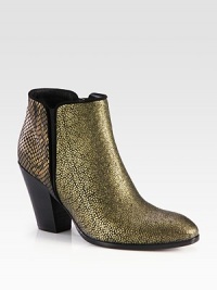 Trend-worthy silhouette of snake-embossed metallic leather with suede trim, a stacked heel and elastic side gores. Stacked heel, 3½ (90mm)Snake-embossed metallic leather upper with suede trim and side elastic goresSide zipLeather lining and solePadded insoleMade in Italy