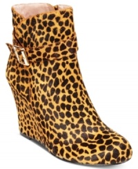 Perfect for prowling. The Dena2 wedge booties by Vince Camuto combine a fierce animal print with a gold buckle accent at the ankle.