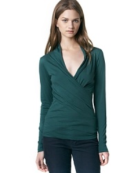 An alluring top in a flattering stretch fabric that features a greek goddess-inspired neckline we love.