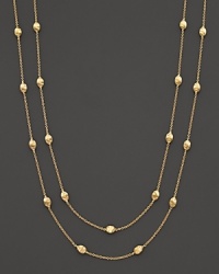 From the Siviglia Collection, the gold necklace with small station gold beads, designed by Marco Bicego. Can be worn doubled or as one long strand.