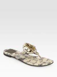 Gleaming signature hardware is at the center of this lizard-print leather sandal, with a rubber sole for added traction. Lizard-print leather upperLeather liningRubber solePadded insoleImported