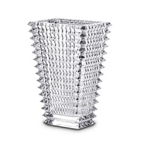 Designed by Nicolas Triboulot for Baccarat, this sparkling crystal vase features extraordinary craftsmanship-horizontal bevel cuts on the outside and vertical bevel cuts on the inside-for in a dazzling refractive effect.