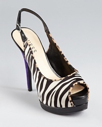 Black and white and striped all over, these GUESS pumps go forth in zebra print satin, leopard print trim, and a standout purple heel.