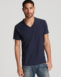 V-neck tee with allover slub texture and raw edges.