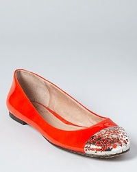 A cut-out metal cap toe adds a bold look to a juicy pair of glossy, attention-grabbing orange flats. From VINCE CAMUTO.