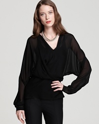 Bring your wardrobe back to black in an effortless Halston Heritage blouse, touting artful draping and sheer styling for a decadently dark style statement.