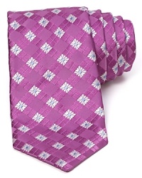 A squared floral print makes a statement on a silk tie from Ike Behar.