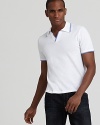 A classic tennis polo from Michael Kors gets the modern treatment with a trim fit for a vintage-inspired style.