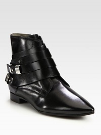 Must-have leather ankle boot with a classic point toe and edgy metal hardware. Leather upperPoint toeSide zip and straps with metal pull-tab closuresLeather lining and solePadded insoleMade in Italy