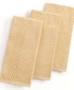 Grab style and keep function with a set of three kitchen towels that step forward in a calm color to wipe up spills, aid in prep and add an accent to your space. The textured design sets a sharp appearance for any room, while the highly absorbent terry quickly cleans up. Limited lifetime warranty.