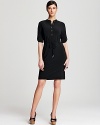 Master utilitarian city-chic in this Calvin Klein shirt dress. A pared-down silhouette sets the framework for smart, strong dressing, whether you're headed to cocktails or the corner office.