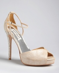 Wedding worthy, these Badgley Mischka platform pumps feature elegantly jeweled heels and the most delicate of straps.