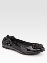 A modern classic in shiny patent leather with logo detail, tonal stitching and a comfortable elasticized back. Front patent leather logo Elasticized back Leather lining Padded insole Rubber sole ImportedOUR FIT MODEL RECOMMENDS ordering true size.. 