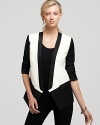 Give your look a sharp finish with Tibi's on-trend tuxedo jacket in chic monochrome color blocking.