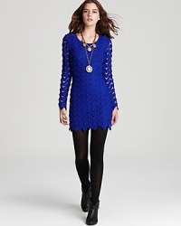 With a large keyhole back cutout and zig zag crochet details, this edgy Free People dress takes the season by storm--classic fall booties complete the look.