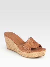 Earthy cork wedge and platform graced by a supple leather upper with embroidery-like stitching. Cork wedge, 2½ (65mm)Cork platform, 1 (25mm)Compares to a 1½ heel (40mm)Leather upperLeather liningRubber solePadded insoleImportedOUR FIT MODEL RECOMMENDS ordering true size. 