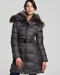 An oversized, adjustable fur collar brings statement luxe to this quilted Dawn Levy puffer coat.