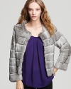 Indulge your cold weather wardrobe with this slightly cropped fur jacket for incomparable warmth and enviable glamour.