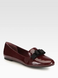 A dimensional grosgrain ribbon bow tops this must-have favorite, crafted of reflective patent leather. Patent leather upper with grosgrain ribbon bowLeather lining and solePadded insoleImported