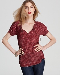 An au courant take on bohemian style, this Joie top boasts smocking details and a vintage-inspired print.