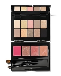 A pretty palette for those on your 'nice' list. Bobbi Brown's toast-of-the-town collection features an array of colors for lips and eyes-all in a mirrored compact.Ten eye shadows in mix-and-match textures create shimmering, light-catching looks. A quartet of lip gloss colors completes the bubbly mood by adding glittery depth and high shine to lips. Includes mini versions of Bobbi Brown's lip and eye shadow brushes.