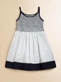 Crafted in plush cotton, this fancy frock's smocked bodice, full skirt and perky polka dots complete the look.Spaghetti strapsRound necklineButton backSmocked bodiceBack tie waistFull skirtFully linedCottonMachine wash coldImported Please note: Number of buttons may vary depending on size ordered. 