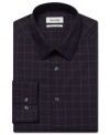 Make your mark in a classic pattern with this slim-fit no-iron checkered dress shirt from Calvin Klein.