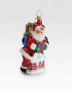 A traditional glass ornament shows Santa and gifts sneaking down the chimney.Hand-blownHand-painted6.5 tallMade in Poland