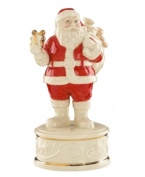 Enjoy the sights and sounds of Christmas. This musical figurine stars a classic Santa Claus on a pedestal of ivory porcelain with red, gold and beautiful scrolling detail. Plays Up On the Roof Top.