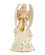 An ethereal figure draped in ivory and gold, this porcelain angel from Lenox is a beacon of hope throughout the holidays. Pierced accents reveal a light from within.