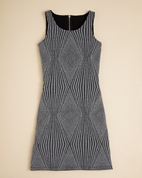 Aqua cuts this sleeveless dress to perfection, adding an allover diamond pattern with a glitter finish.