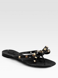 Low-cut silhouette sprinkled in edgy studs, topped with a signature bow. Studded PVC upperPVC lining and solePadded insoleMade in ItalyOUR FIT MODEL RECOMMENDS ordering one half size down as this style runs large. 