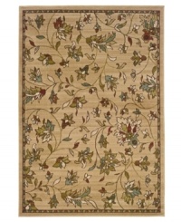 Beauty underfoot. A lush floral-and-leaf motif evokes a casual elegance, enhancing your space with a delicate, muted palette. This plush area rug from Sphinx graces any space with a quiet charm and is woven from durable polypropylene, ensuring long-lasting beauty for years to come.