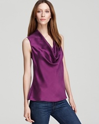 A searing jewel tone glows atop a silky Three Dots top, finished with a plunging neckline for a super-feminine feel. Make it a workweek staple with a blazer, then add decadent accents for an elegant evening alternative.