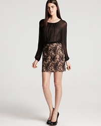 Raglan sleeves lend a youthful look to a sophisticated lace dress from Aidan Mattox.