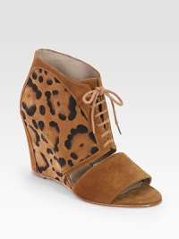 Lace-up suede confection with a unique leopard print and cutout front. Self-covered wedge, 3½ (90mm)Leopard-print suede upperLeather lining and solePadded insoleImported