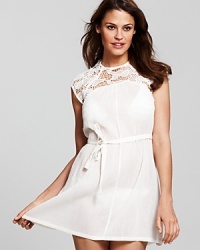 Lace to the finish with this cap-sleeved cover up from French Connection. Its girlie silhouette and waist detailing perfect feminine post-plunge style.