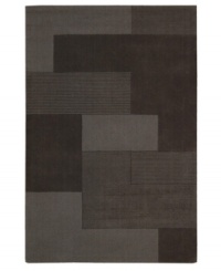 An abstract pattern makes a bold, modern statement upon this inviting Bowery area rug from Calvin Klein. Generously thick wool fibers are hand tufted in India for remarkable strength and detailed design.