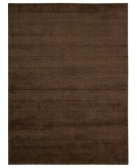 Skilled hand-carving creates an absorbing geometric block pattern on this premium Nourison area rug. Crafted with the timeless art of Tibetan hand-knotting, this deep brown piece features a soft blend of wool and Luxcelle fibers for a distinctive, satiny texture and sheen. (Clearance)