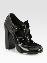 A chunky stacked heel elevates this patent leather silhouette, updated with double adjustable straps. Stacked heel, 4¼ (110mm)Patent leather upperDouble adjustable straps with metal pull-tab closuresLeather lining and solePadded insoleMade in ItalyOUR FIT MODEL RECOMMENDS ordering one size up as this style runs small. 