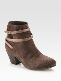 Adjustable leather strap wraps around this butter-soft suede ankle boot while a stacked heel adds a touch of height. Stacked heel, 2½ (65mm)Suede and leather upperLeather lining and solePadded insoleImported