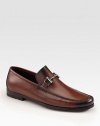 Equestrian-inspired bit defines this Italian leather loafer. Suede upperLeather liningPadded insoleRubber soleMade in Italy