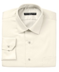 Crafted in convenient wrinkle wash fabric and expertly tailored for the modern man, this fitted Geoffrey Beene dress shirt jump-starts any guy's workweek wardrobe.