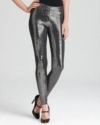 Put some shine in your step with these MICHAEL Michael Kors leggings shimmering with an abundant sequin finish. Polish of the pair with pumps and rock n' roll to the top of the fashion set.