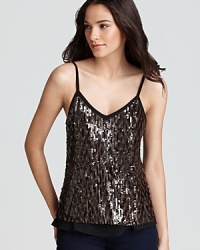 Top off your skinny jeans with this party-perfect top by GUESS, embellished with sequins and touches of sheer perfection.