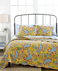 An exotic escape! Reminiscent of a fun island getaway, this Pavvan quilt set boasts bright, luscious florals upon a vivid orange backdrop. Scalloped edges finish the look with even more style.