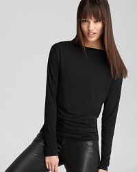 Ultra soft and super sleek, this perfectly fitted Vince boat-neck tee is a wardrobe essential.